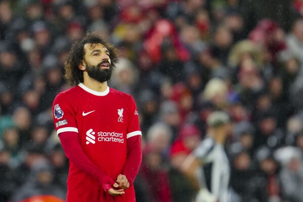 Salah scores 2 after changing boots as Liverpool beats Newcastle